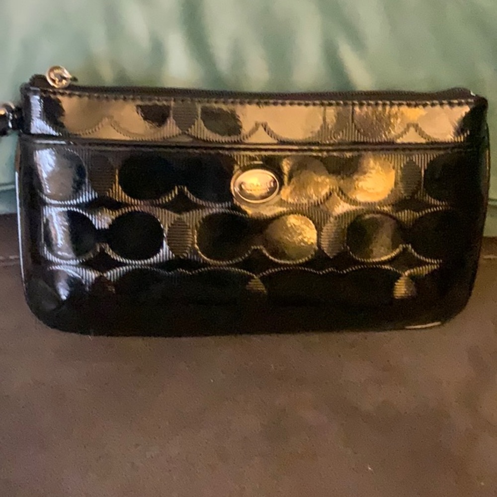 EUC Coach black leather wristlet.